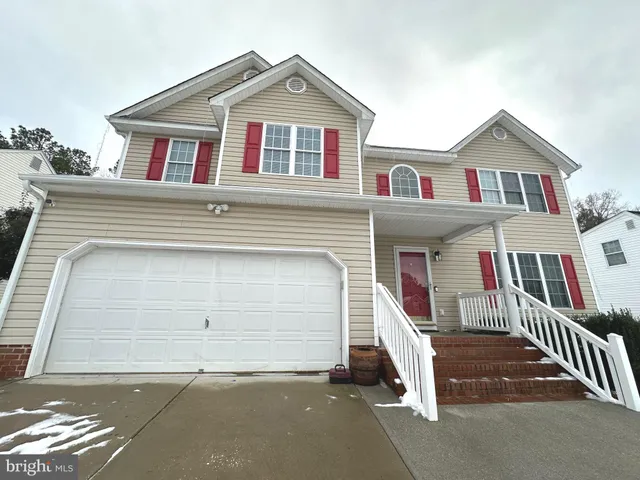 a view of a brick house with large windows