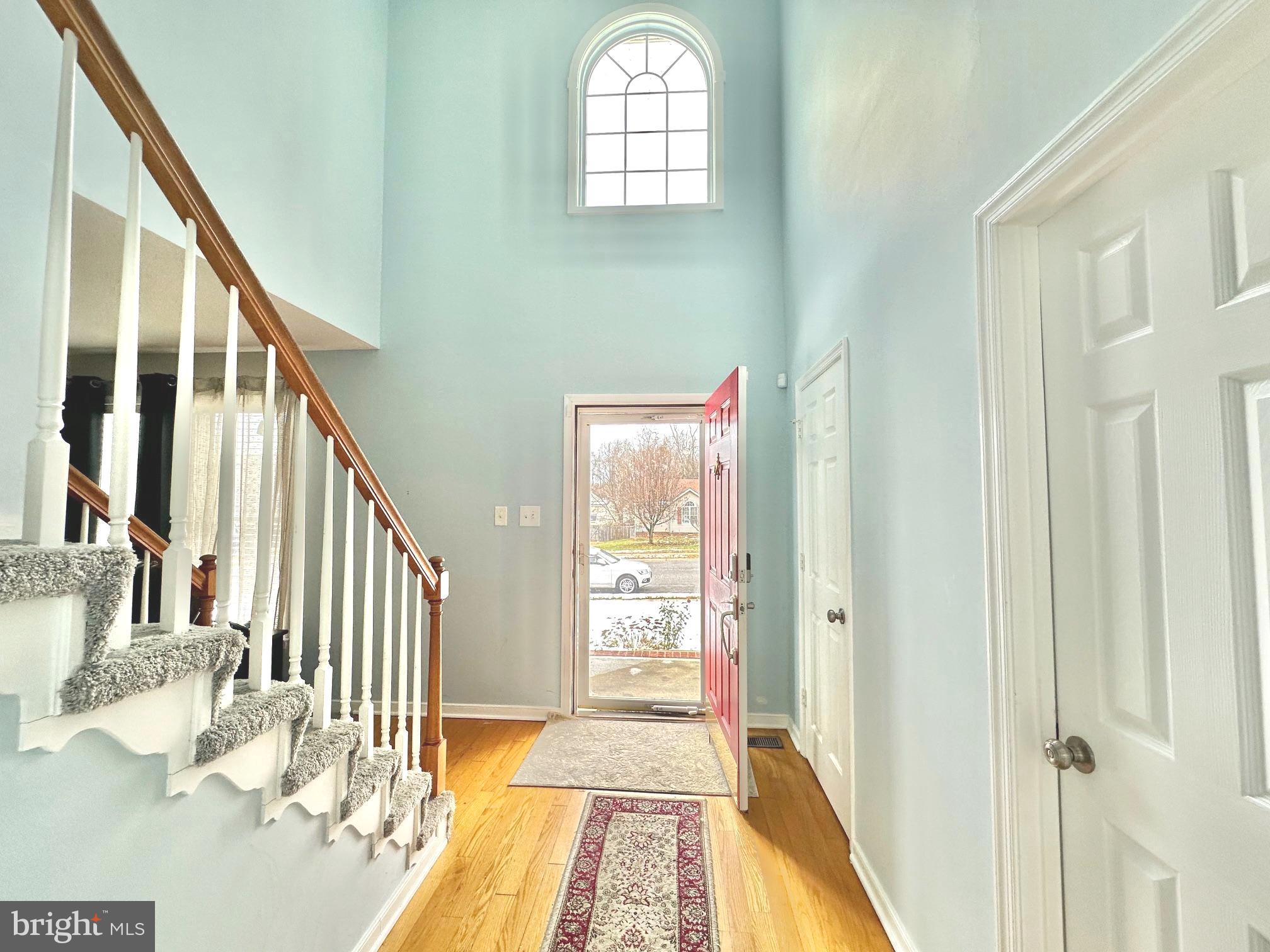 4343 Stately Oak Road North Chesterfield, VA 23234 - Photo 7 of 17 a view of a hallway with wooden floor and staircase