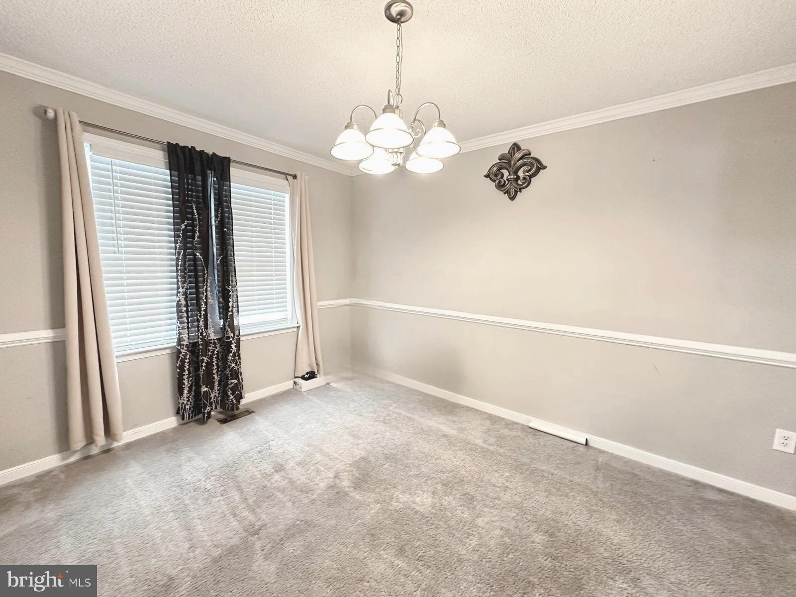 4343 Stately Oak Road North Chesterfield, VA 23234 - Photo 8 of 17 an empty room with chandelier fan