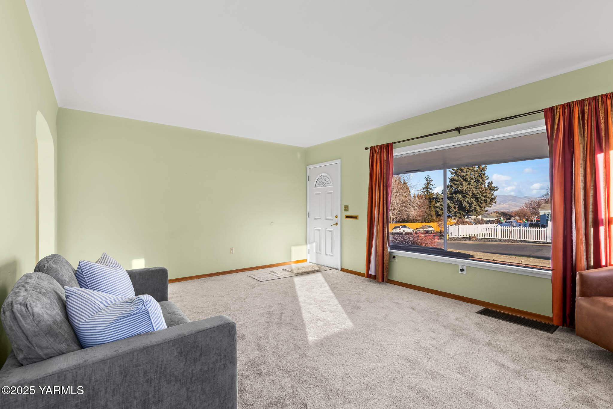 304 North 35th Avenue Yakima, WA 98902 - Photo 24 of 31 a living room with furniture and a floor to ceiling window