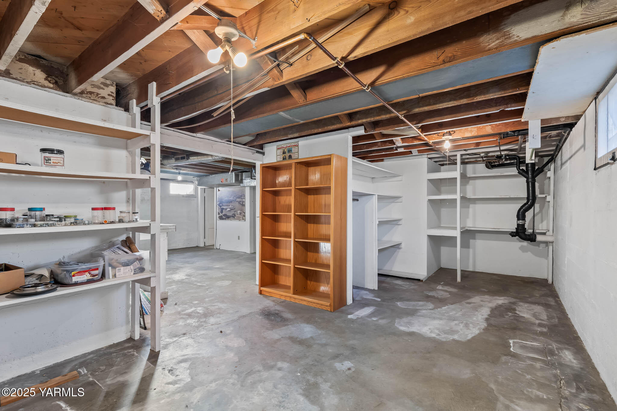 304 North 35th Avenue Yakima, WA 98902 - Photo 10 of 31 a view of walk in closet with clothes and shoes