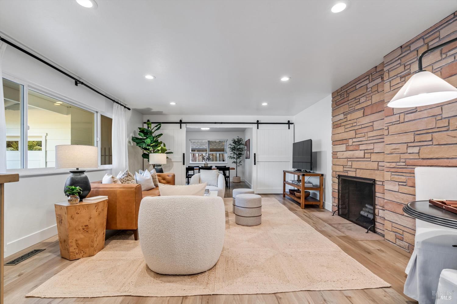 47 Hoff Road Kenwood, CA 95409 - Photo 8 of 45 Living room with wood burning fire place and access to the dining room or use as a study.