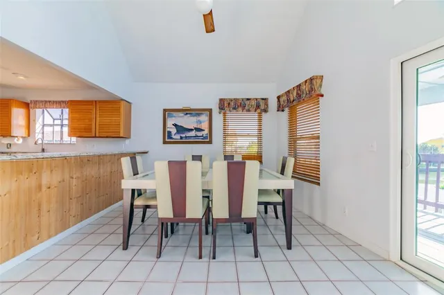 a view of a dining room with furniture and window