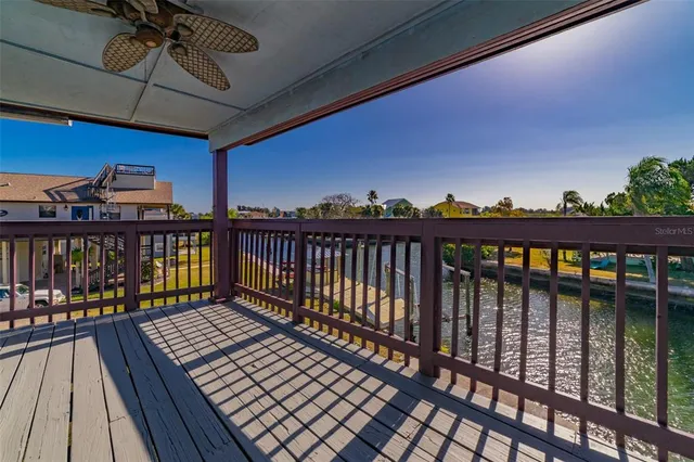a view of a dining room with furniture and a chandelier