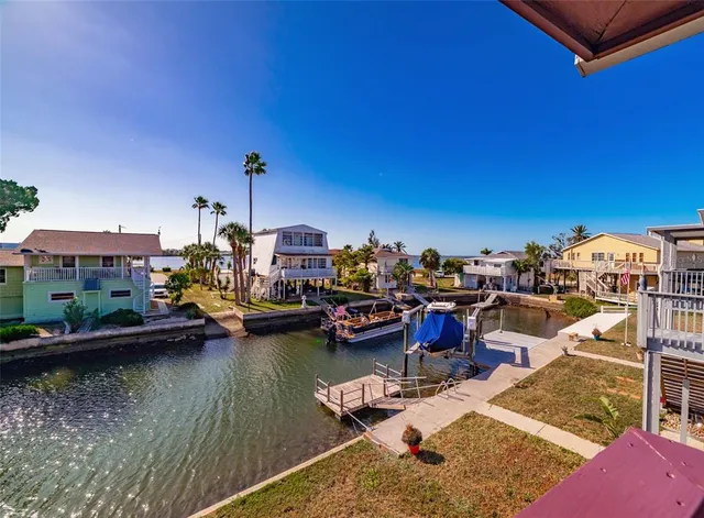 a bedroom with a bed and a lamp next to a window