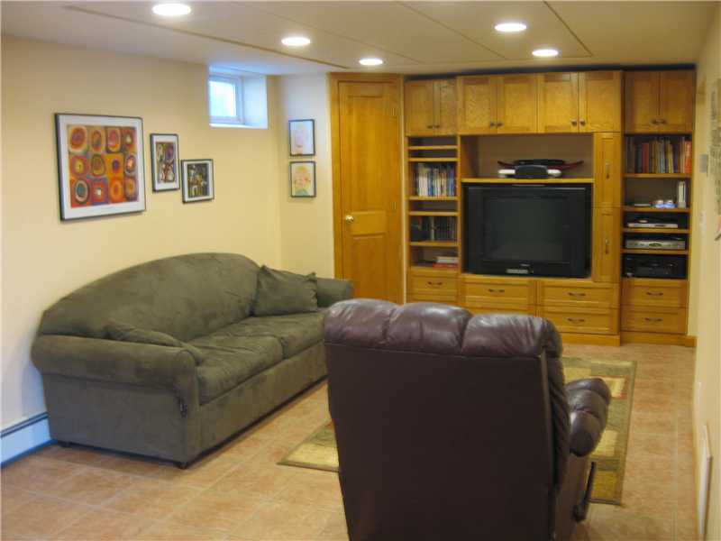 84 Old Great Road North Smithfield, RI 02896 - Photo 11 of 15 Den/Family/Great Room. Tiled family room /computer room with functional custom built ins