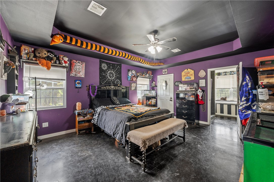 306 Randy Drive Woodway, TX 76712 - Photo 11 of 26 a bedroom with a bed workspace and a window