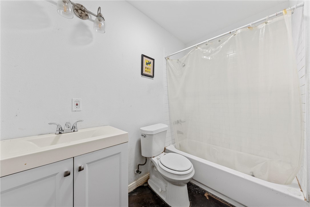 306 Randy Drive Woodway, TX 76712 - Photo 14 of 26 a bathroom with a sink a toilet and shower