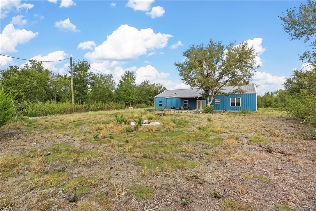 306 Randy Drive Woodway, TX 76712 - Photo 19 of 26 a backyard of a house with lots of green space