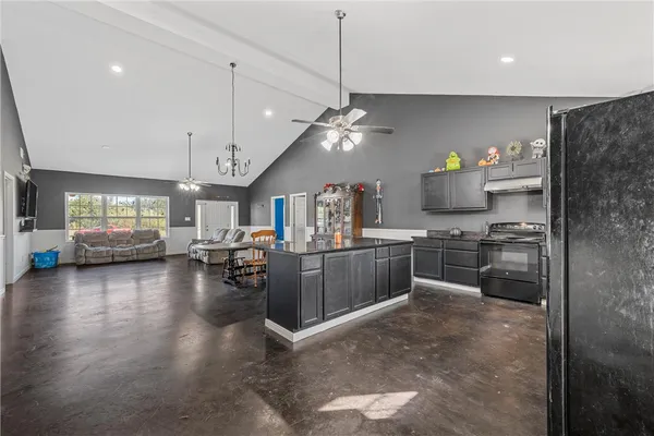 a kitchen and a refrigerator in a kitchen