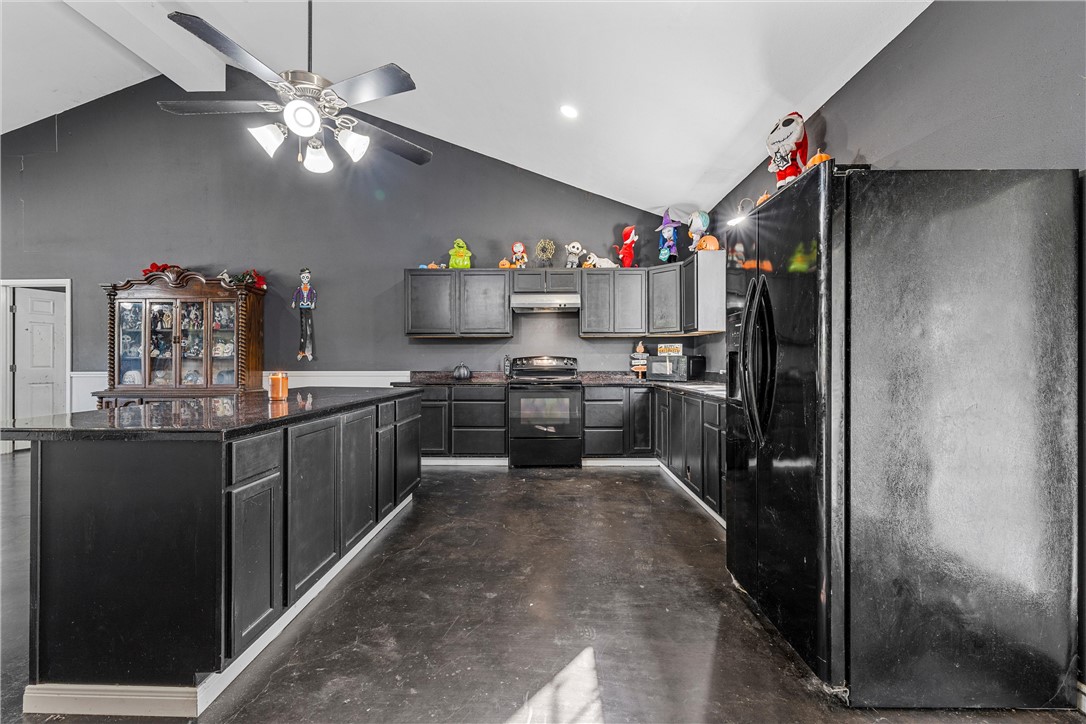 306 Randy Drive Woodway, TX 76712 - Photo 9 of 26 a kitchen with kitchen island granite countertop stainless steel appliances a sink counter space and cabinets
