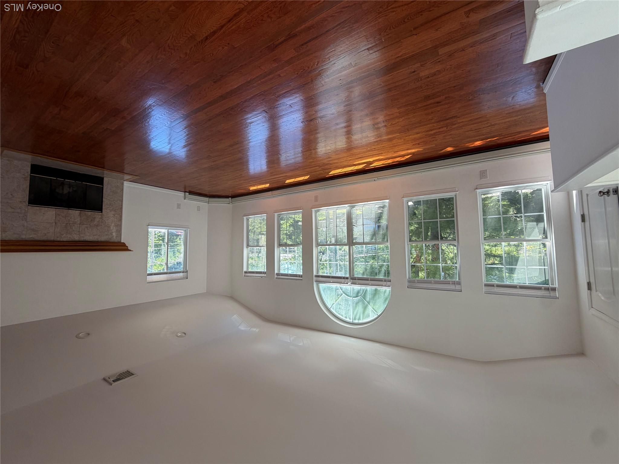 57 Dunwood Road, Unit B Port Washington, NY 11050 - Photo 2 of 8 Oversized Living room. Oversized Dining room. High Sealings