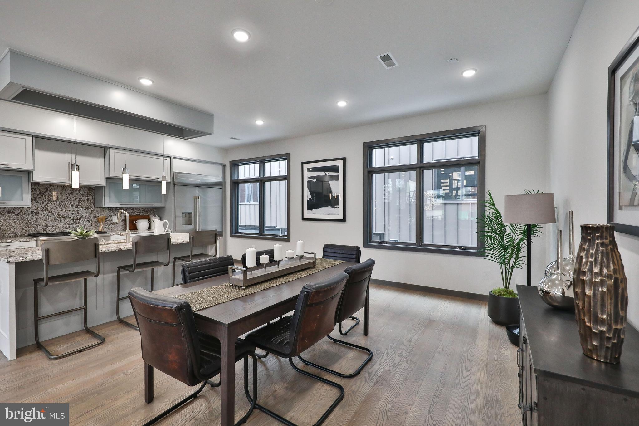 1024 Christian Street Philadelphia, PA 19147 - Photo 12 of 44 a living room with furniture a dining table and chairs