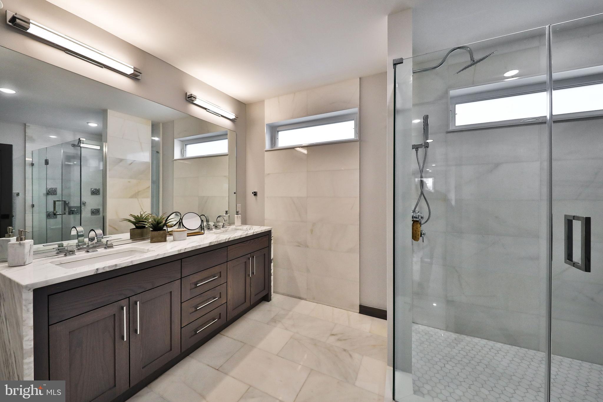 1024 Christian Street Philadelphia, PA 19147 - Photo 30 of 44 a bathroom with a double vanity sink mirror and shower