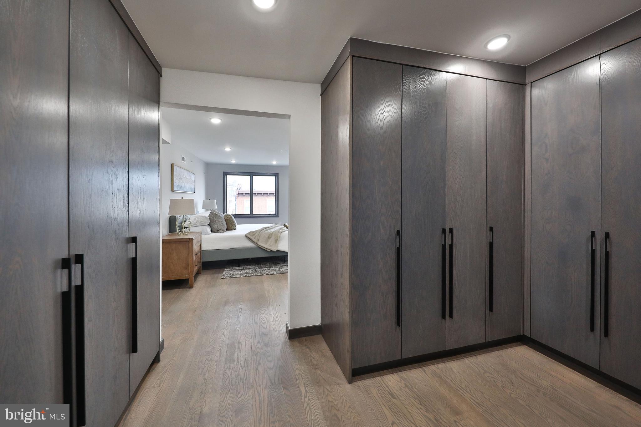 1024 Christian Street Philadelphia, PA 19147 - Photo 31 of 44 a view of a hallway with wooden floor and a bathroom