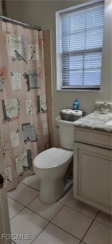 a bathroom with a toilet and a sink