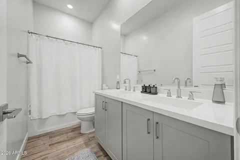 a view of bathroom with a sink and mirror