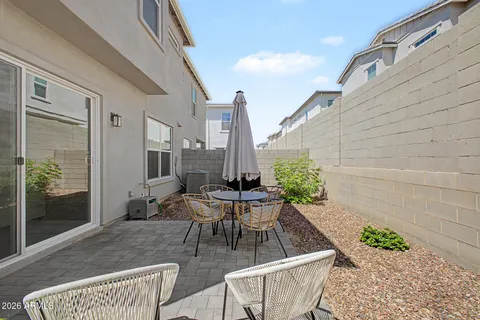 a view of an outdoor dining space with a patio