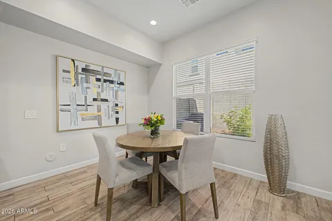 a view of a dining room with furniture and window
