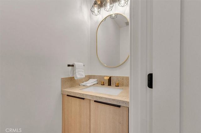 a bedroom with a bed and a night stand