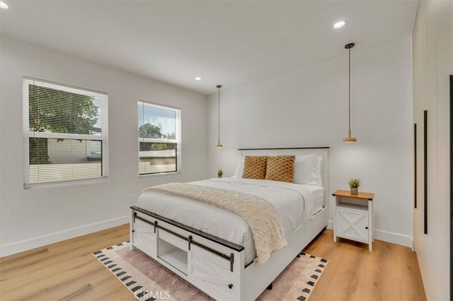 a bedroom with a bed and a walk in closet