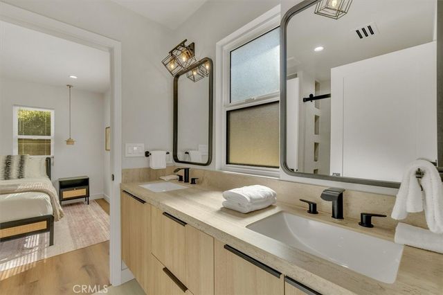 a bedroom with bed and window