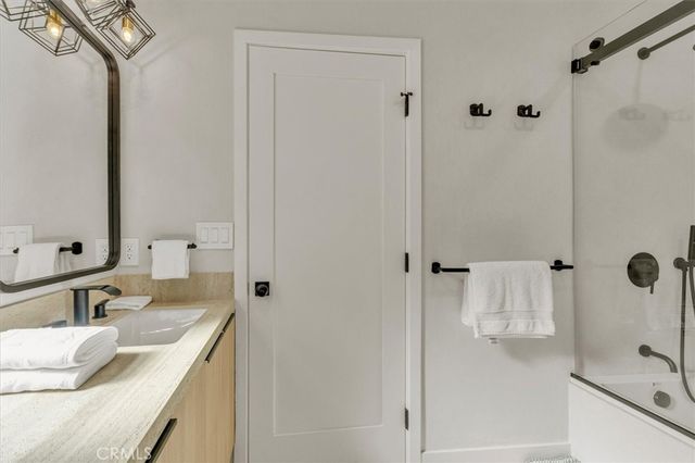 a bed room with a bed and a window