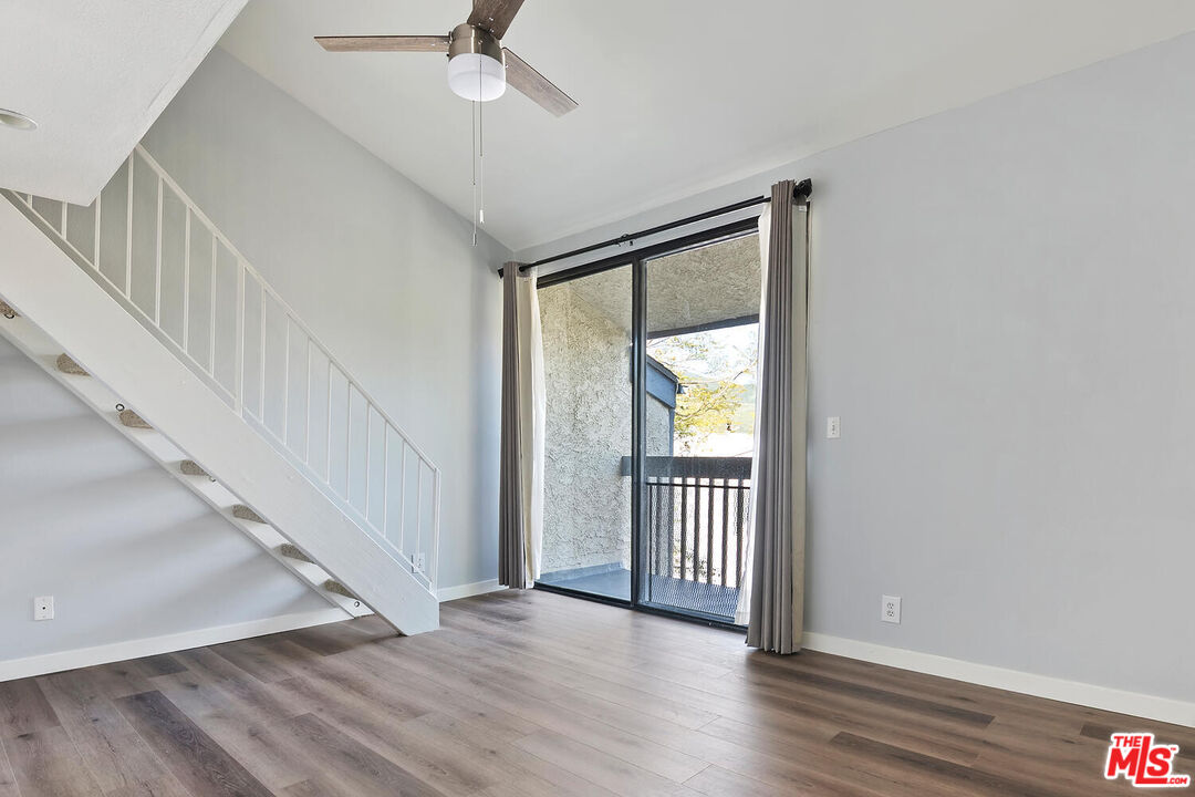 29239 Heathercliff Road, Unit 12 Malibu, CA 90265 - Photo 18 of 32 a view of a hallway with wooden floor and entryway