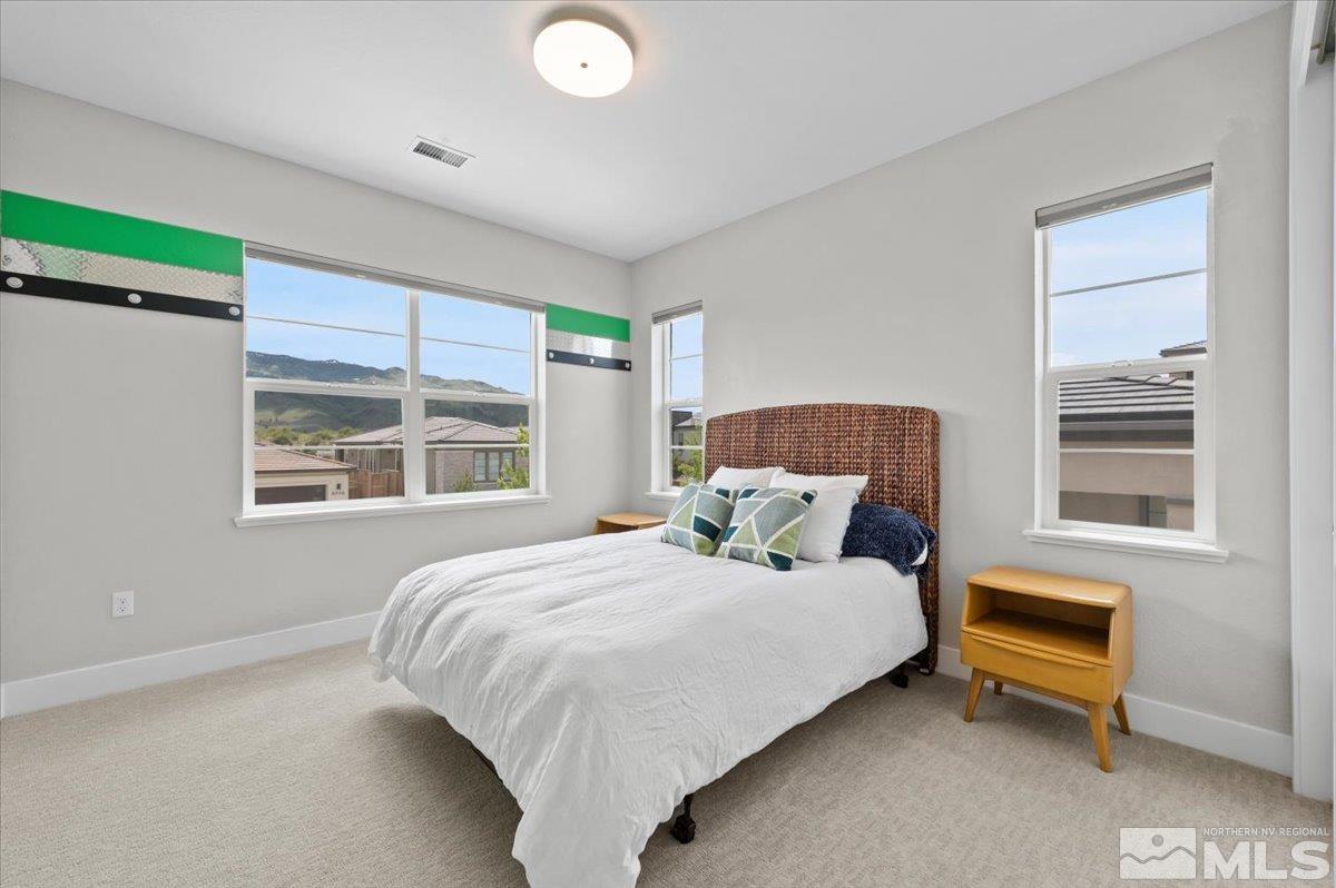 8773 Larkhaven Trail Reno, NV 89523 - Photo 27 of 38 a bedroom with a bed and a window