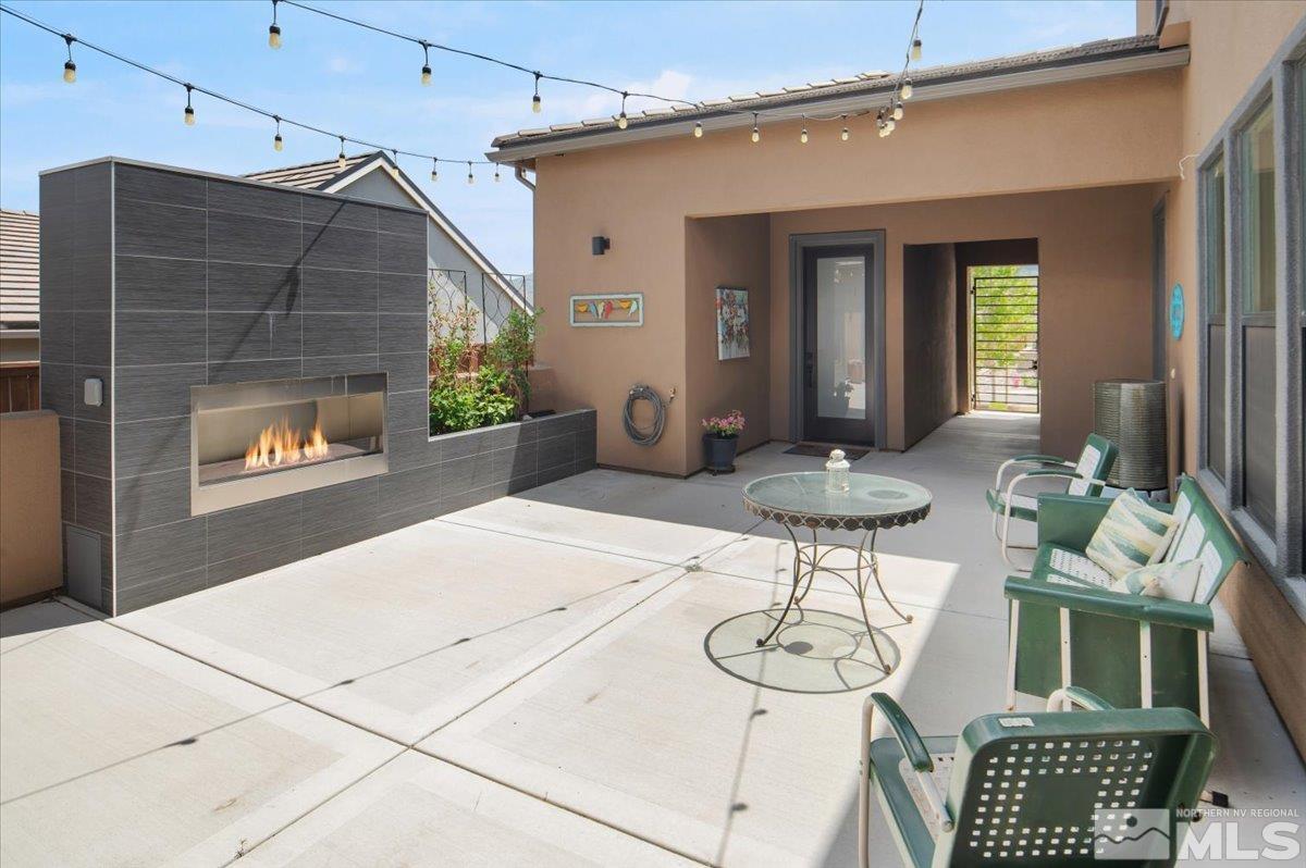 8773 Larkhaven Trail Reno, NV 89523 - Photo 3 of 38 a table and chairs in a patio