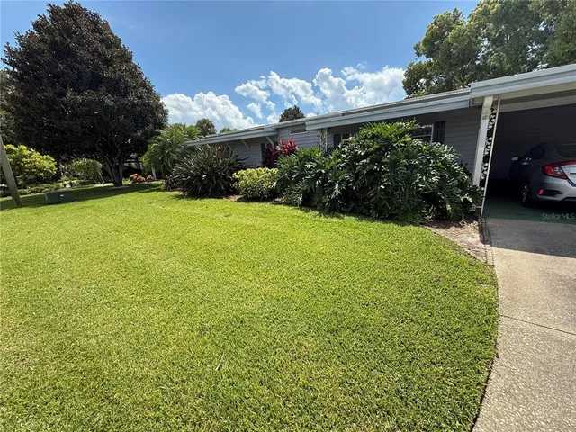 a view of a back yard of the house