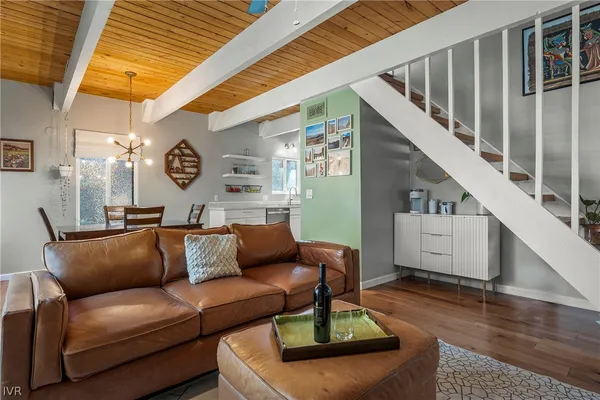 a living room with furniture and a clock