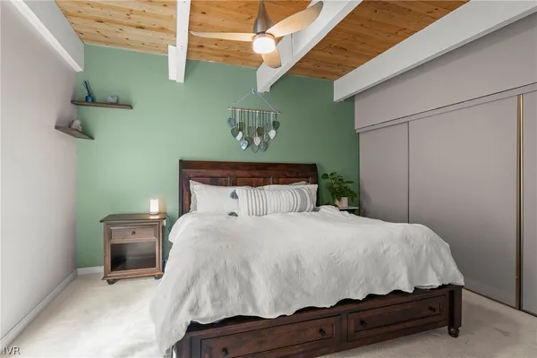 a bedroom with a bed and a table