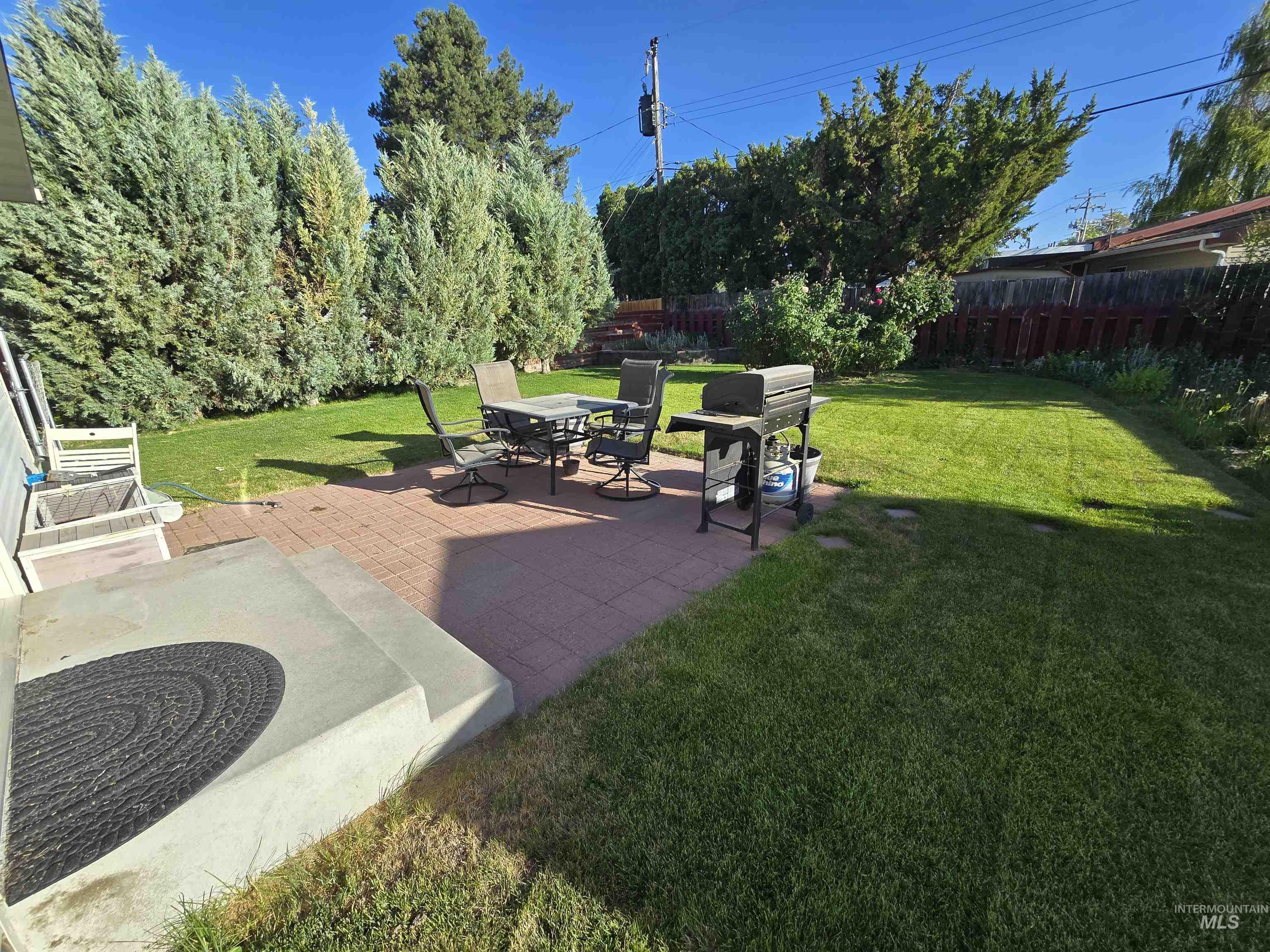 1818 Granada Drive Twin Falls, ID 83301 - Photo 3 of 16 Fenced backyard with a patio