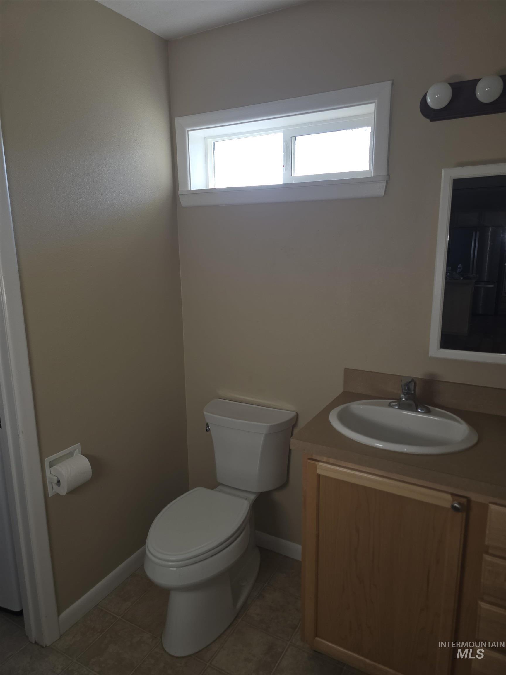 1818 Granada Drive Twin Falls, ID 83301 - Photo 9 of 16 Bathroom with vanity and tile patterned floors