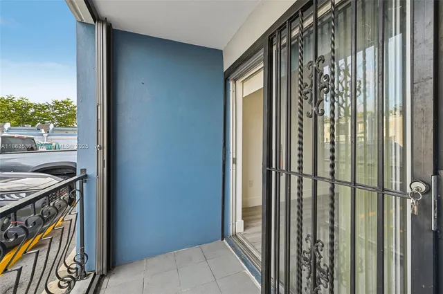 a view of a backyard with a large pool and couches chairs