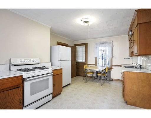 403 Langley Road Newton, MA 02459 - Photo 3 of 20 a kitchen with a stove a refrigerator and a sink