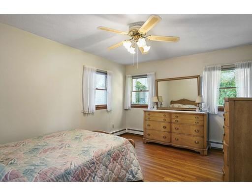 403 Langley Road Newton, MA 02459 - Photo 8 of 20 a bedroom with a bed and a dresser