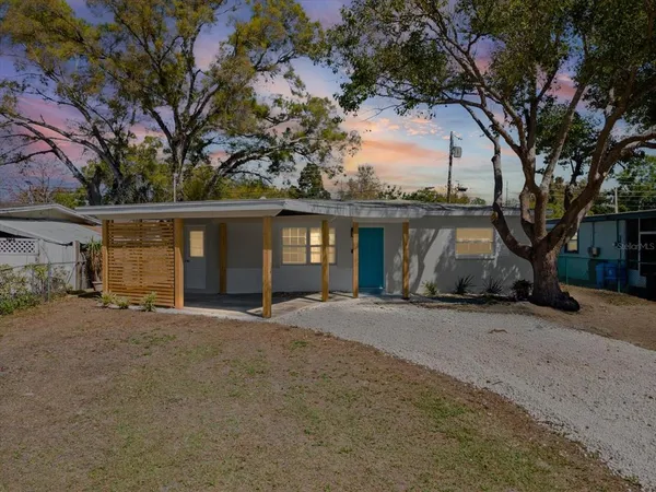 a kitchen with stainless steel appliances a stove sink and cabinets