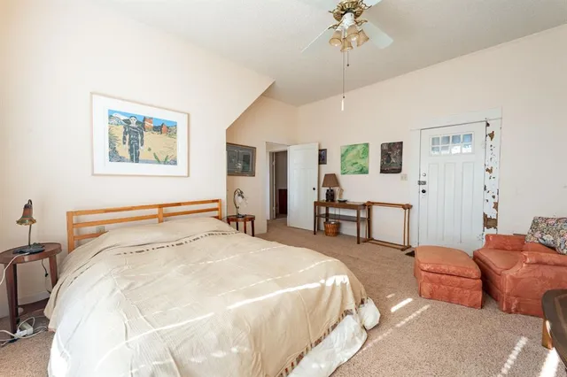 a bedroom with furniture and a window