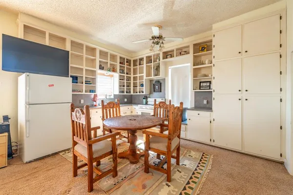 a view of a dining room with furniture window and outside view