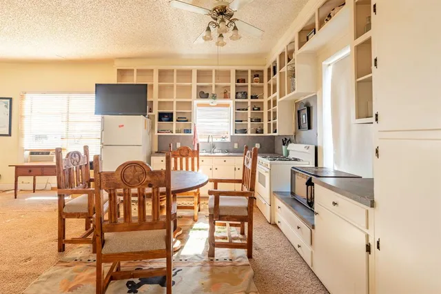 a bathroom with a sink a vanity and a mirror