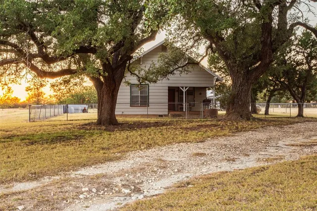 a house with trees in front of it