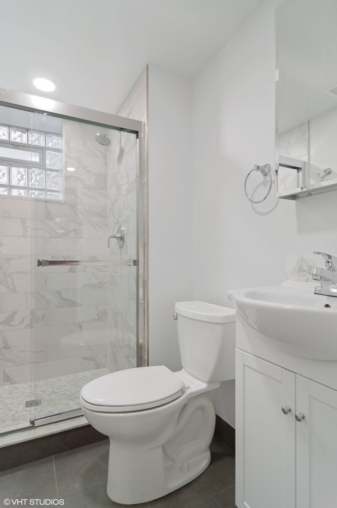 1719 West 18th Street, Unit 2R Chicago, IL 60608 - Photo 8 of 8 a bathroom with a toilet sink and shower
