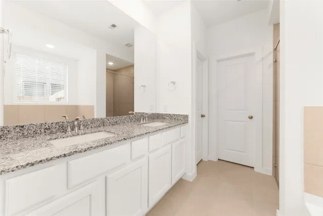 a white bath tub sitting in a bathroom