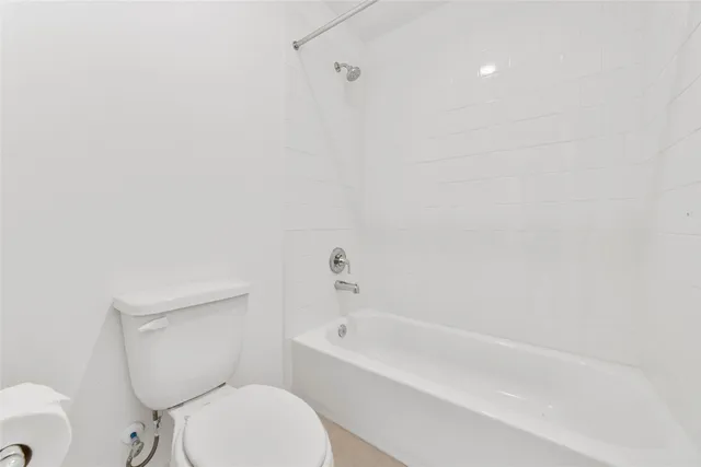 a view of a house with a yard and pathway