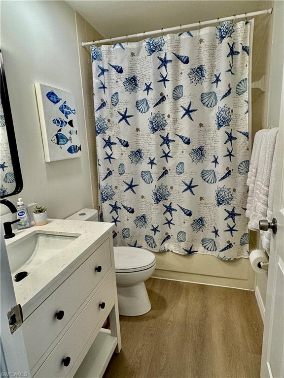 645 Squire Court, Unit 202 Naples, FL 34104 - Photo 11 of 41 a bathroom with a sink toilet and shower