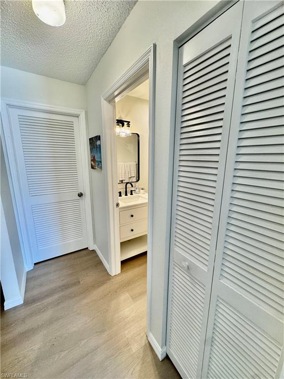 645 Squire Court, Unit 202 Naples, FL 34104 - Photo 15 of 41 a view of a room with wooden door