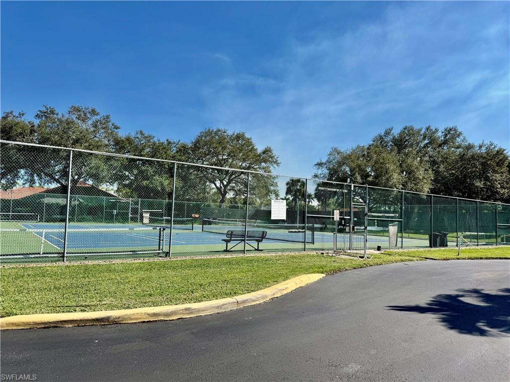 645 Squire Court, Unit 202 Naples, FL 34104 - Photo 33 of 41 a view of a park with swings