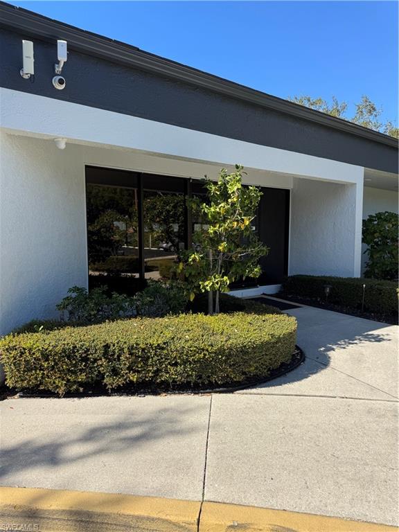 645 Squire Court, Unit 202 Naples, FL 34104 - Photo 35 of 41 a front view of a house